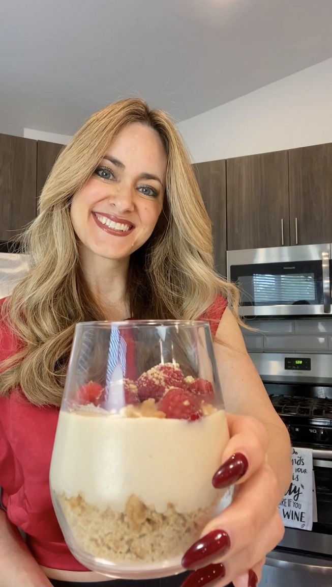lady holding glass of pudding