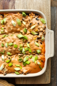 Vegan Cheesy Mexican Tortilla Bake in casserole dish
