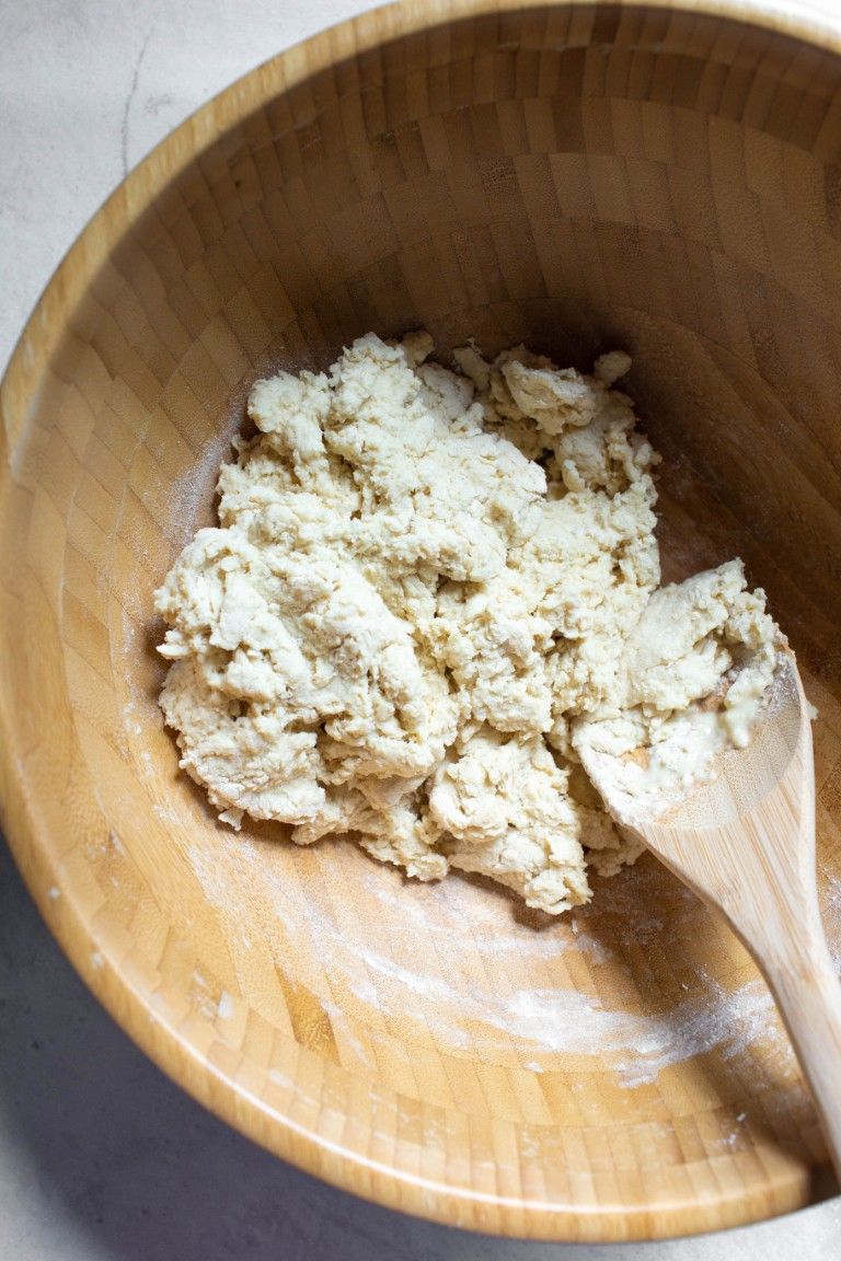 mixed dough in wood bowl