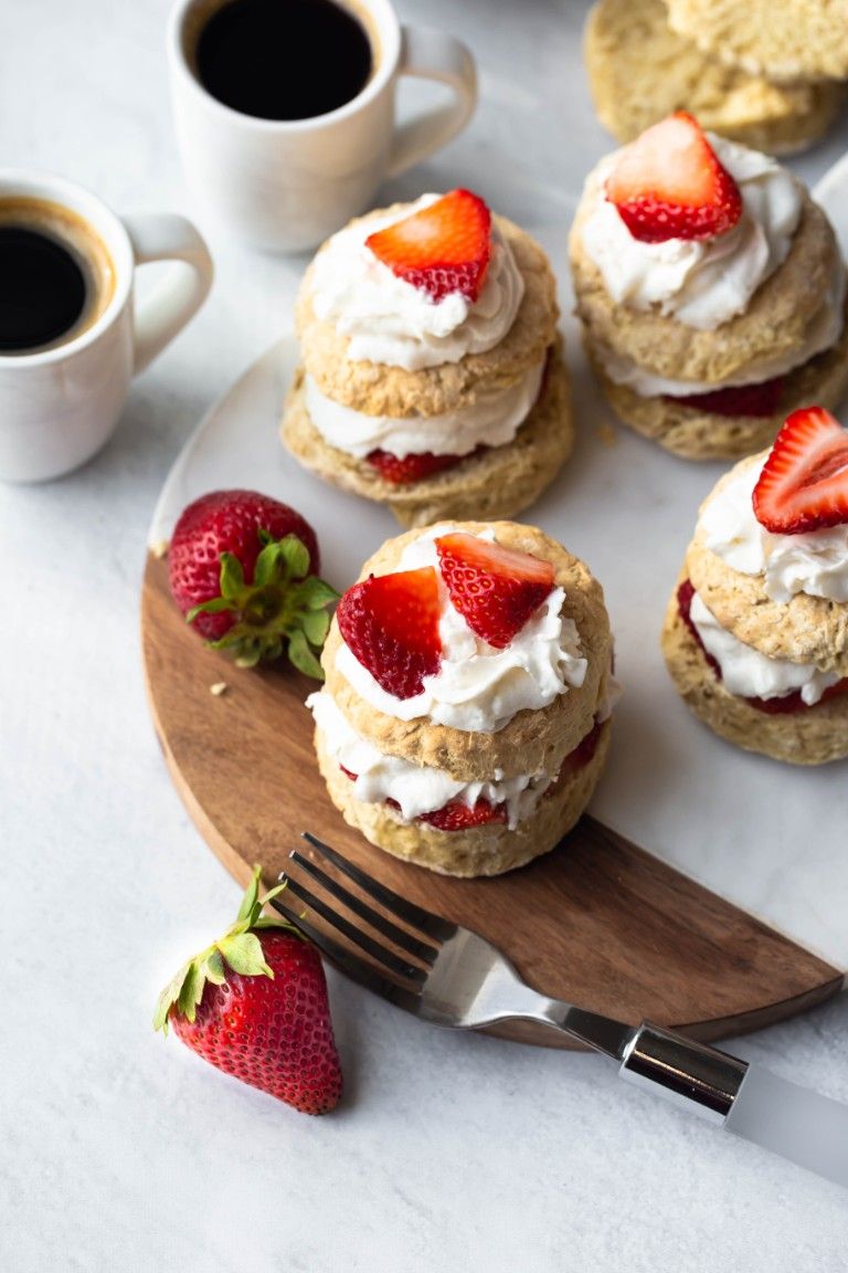 overhead view of several vegan strawberry shortcakes with coffee