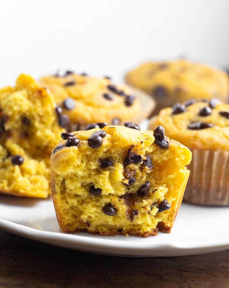 Closeup view of inside fluffy muffin and melted chocolate chips